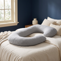 CradleForm G-Shaped Pregnancy Pillow on a made bed