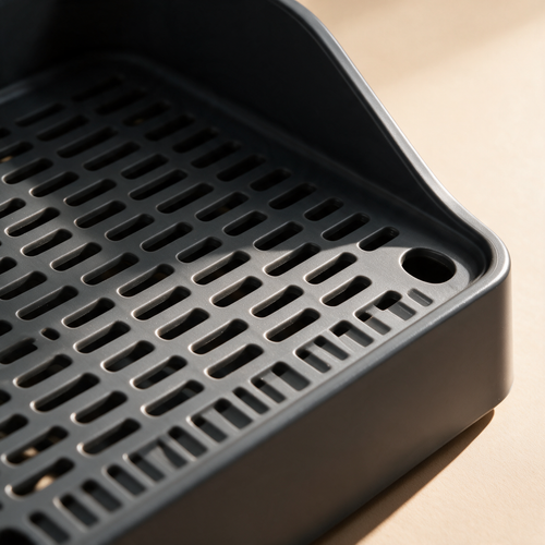 Filtering foot board detail at the litter box entrance